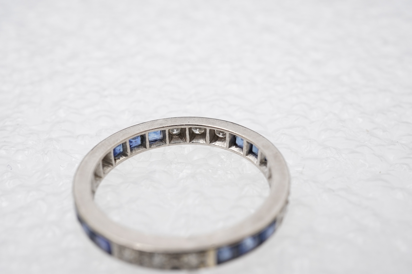 An Art Deco sapphire and diamond eternity ring, 1930s